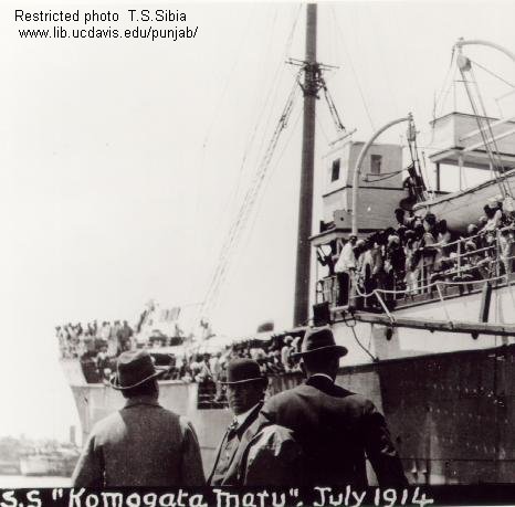 S.S. Komagata Maru July 1914  passengers aboard ship and three men on wharf